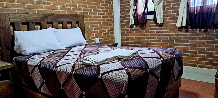 Cabaña Cuádruple, habitación con cama matrimonial