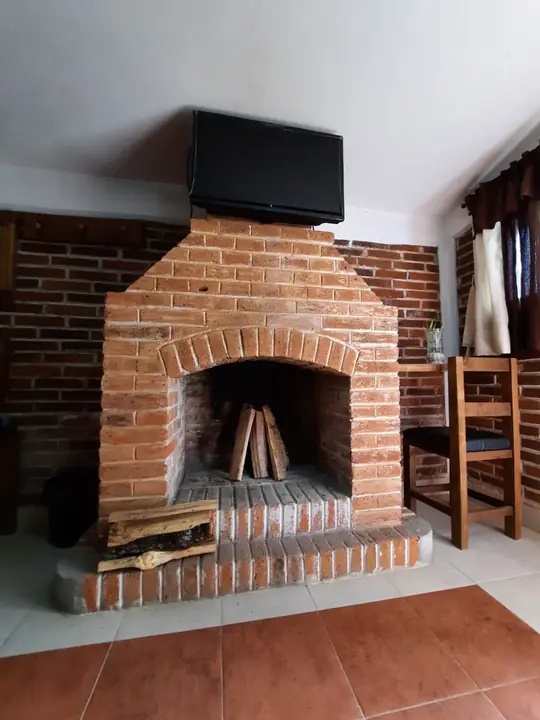 Chimenea de la cabaña triple